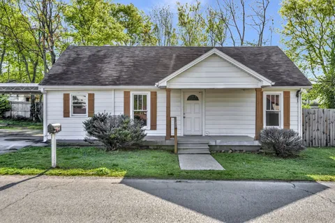 a view of a yard in front view of a house