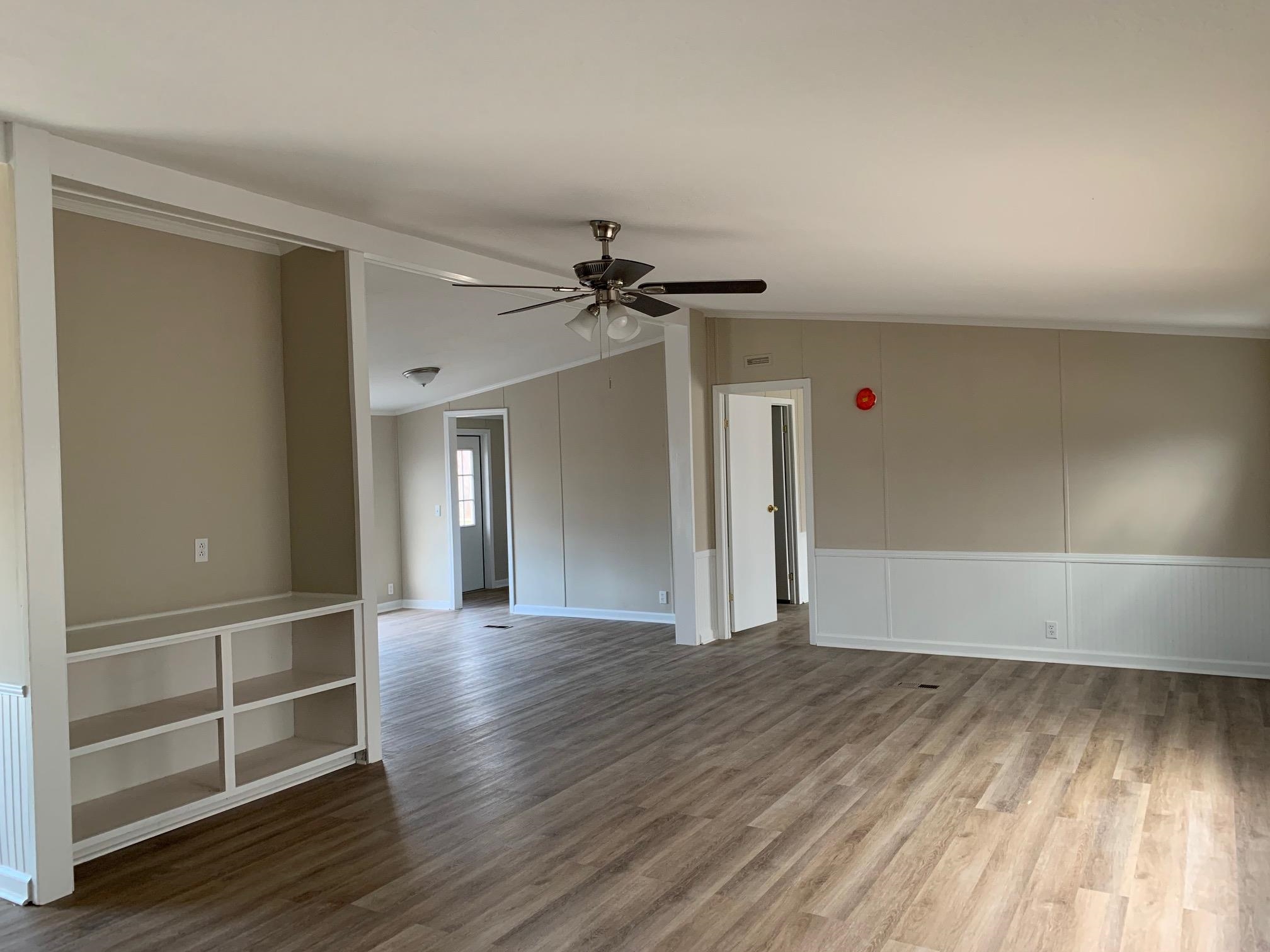 1827 Burks Road Henning, TN 38041 - Photo 11 of 17 wooden floor in an empty room with a window