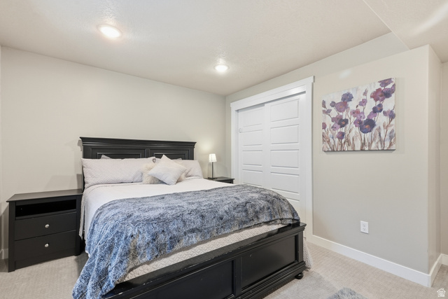 3244 West 1670th Street North Provo, UT 84601 - Photo 44 of 56 Neutral tone walls with recessed lighting and soft carpet flooring