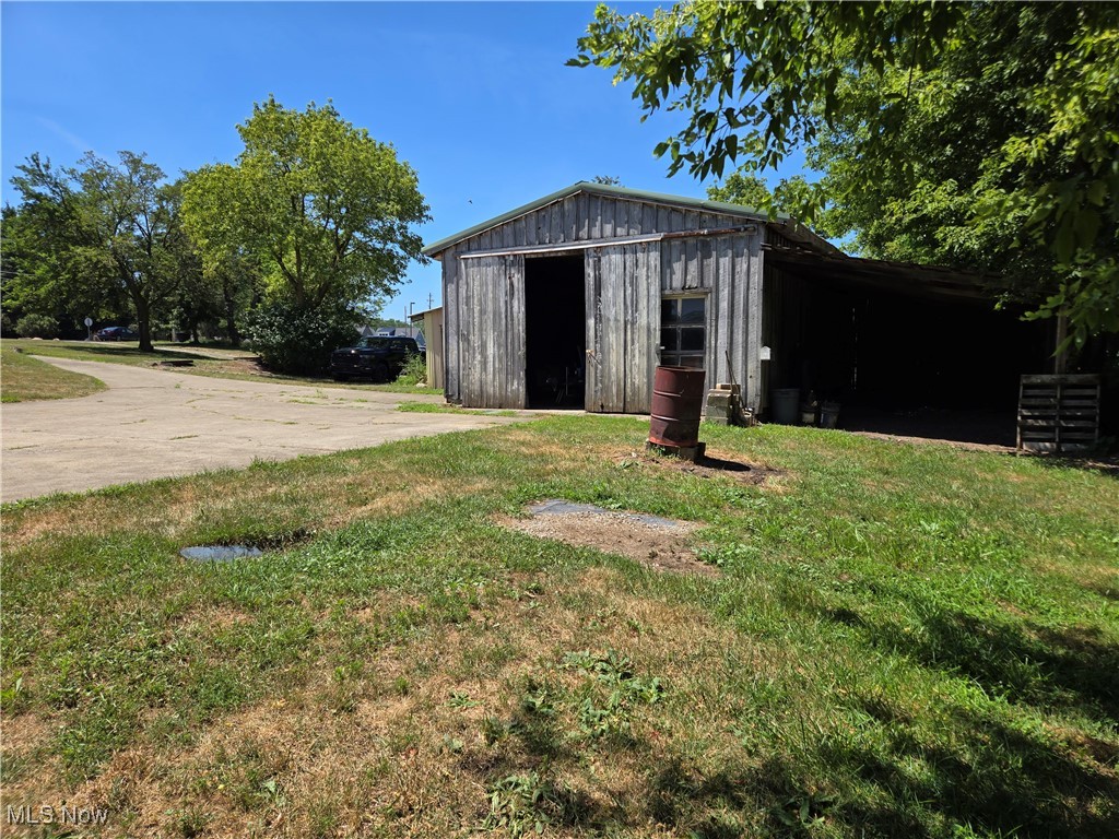 5555 Detroit Road Sheffield, OH 44054 - Photo 41 of 50 View of pole building with a yard