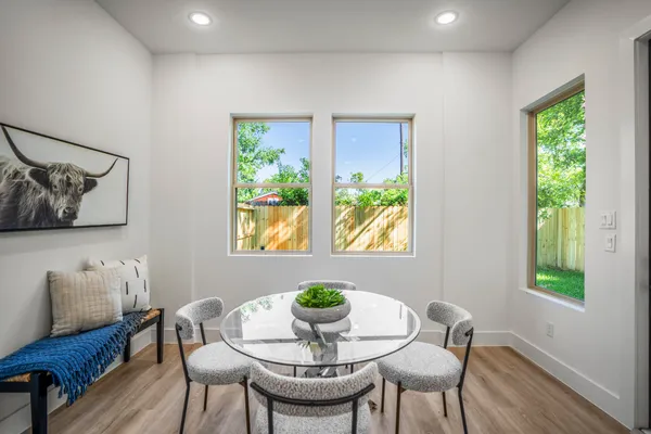 a view of a dining room with furniture window and wooden floor