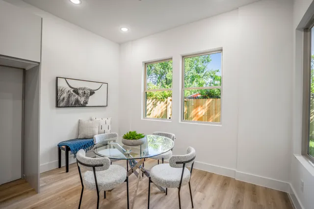 a view of a dining room with furniture and window