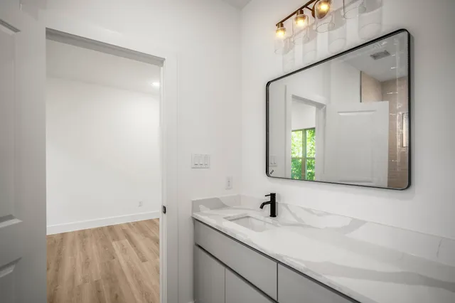 a bathroom with a sink and a mirror