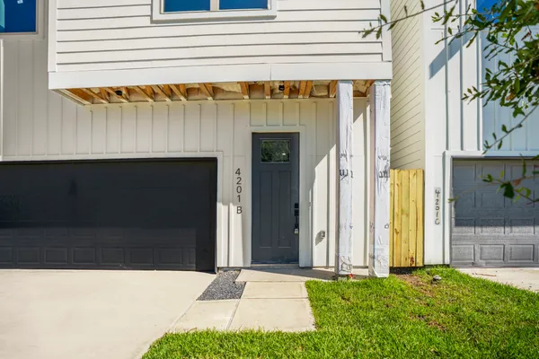 a view of front door and small yard