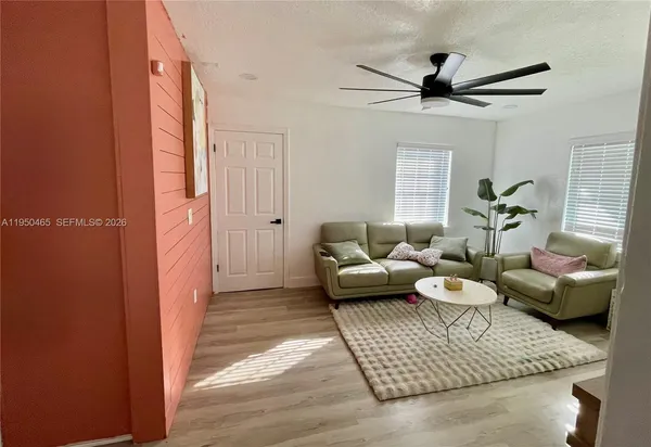 a living room with furniture and a rug