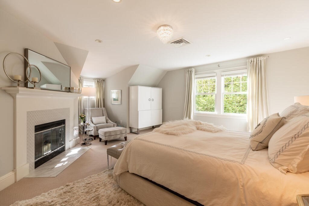 6 Hampton Road Lexington, MA 02421 - Photo 22 of 41 a bedroom with a bed a fireplace and window
