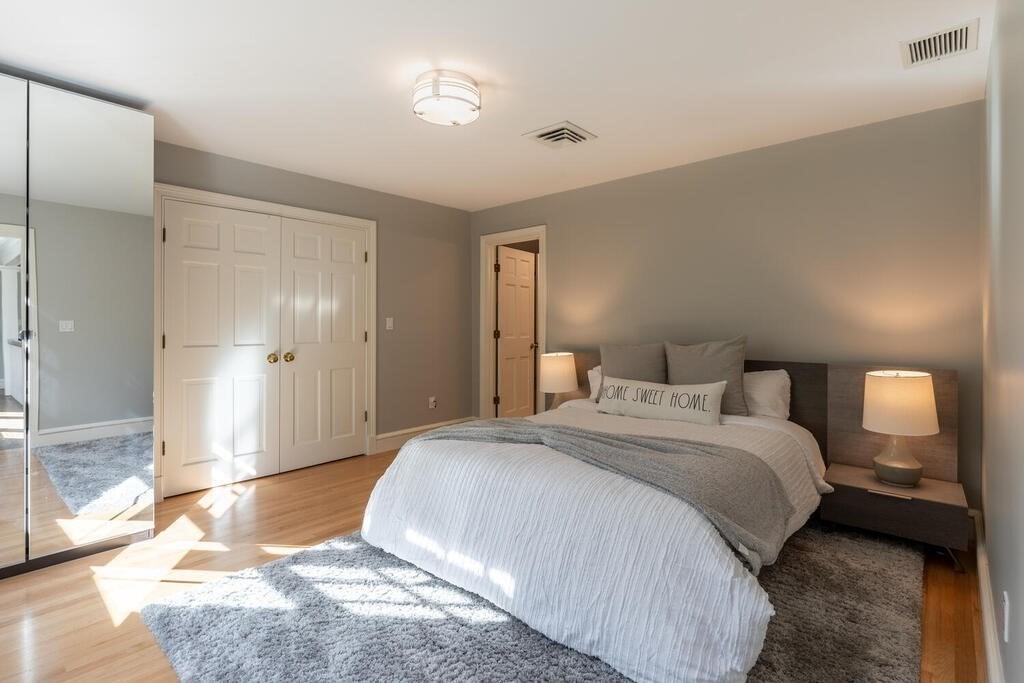 6 Hampton Road Lexington, MA 02421 - Photo 25 of 41 a bedroom with a bed and a view of bathroom