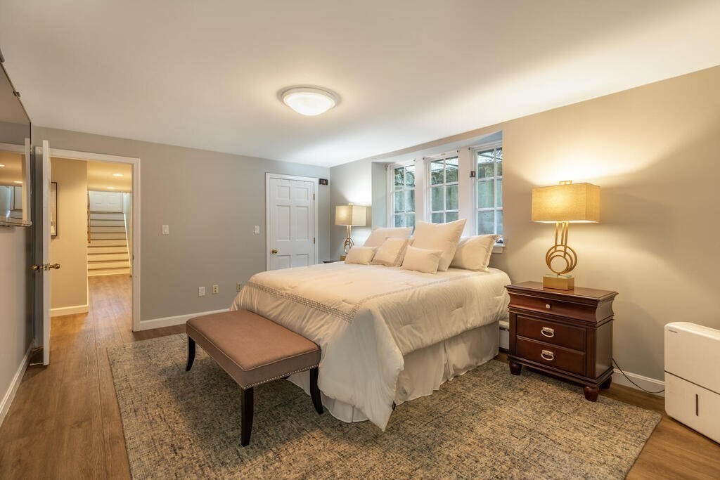 6 Hampton Road Lexington, MA 02421 - Photo 30 of 41 a bedroom with a bed and a lamp
