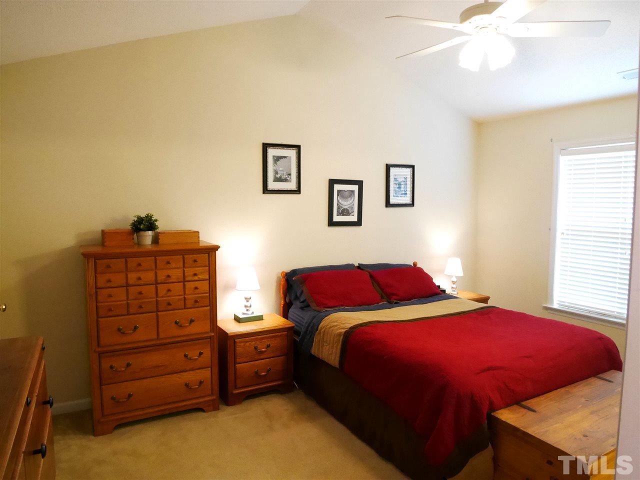 2016 Metacomet Way Raleigh, NC 27604 - Photo 11 of 24 a bedroom with a bed and a dresser