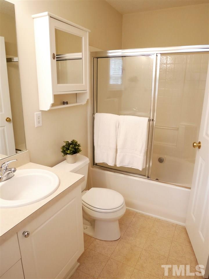 2016 Metacomet Way Raleigh, NC 27604 - Photo 13 of 24 a bathroom with a sink a toilet and shower