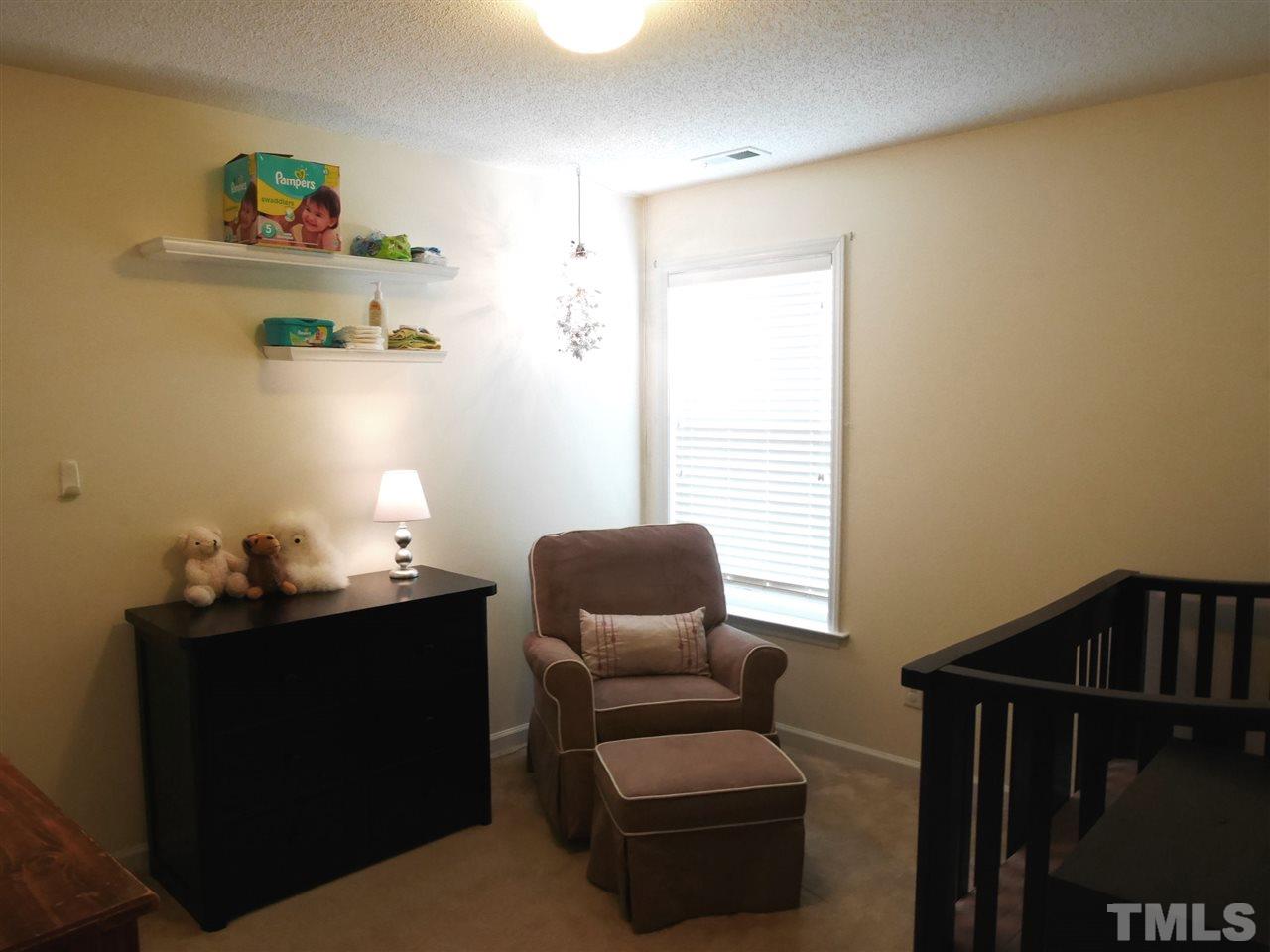 2016 Metacomet Way Raleigh, NC 27604 - Photo 14 of 24 a living room with furniture and a window