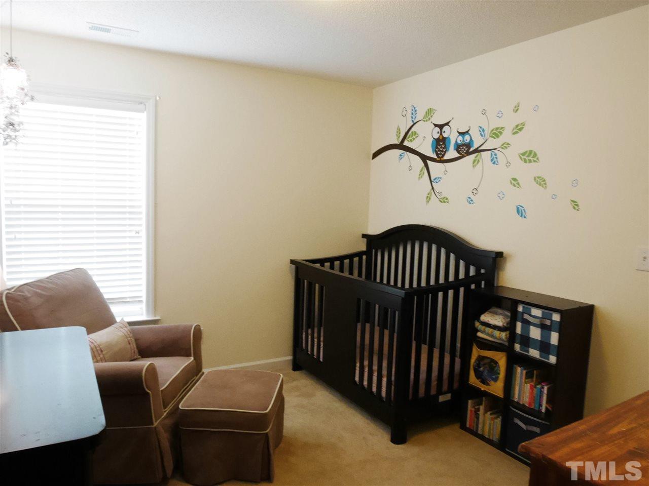 2016 Metacomet Way Raleigh, NC 27604 - Photo 15 of 24 a bedroom with a bed and a couch