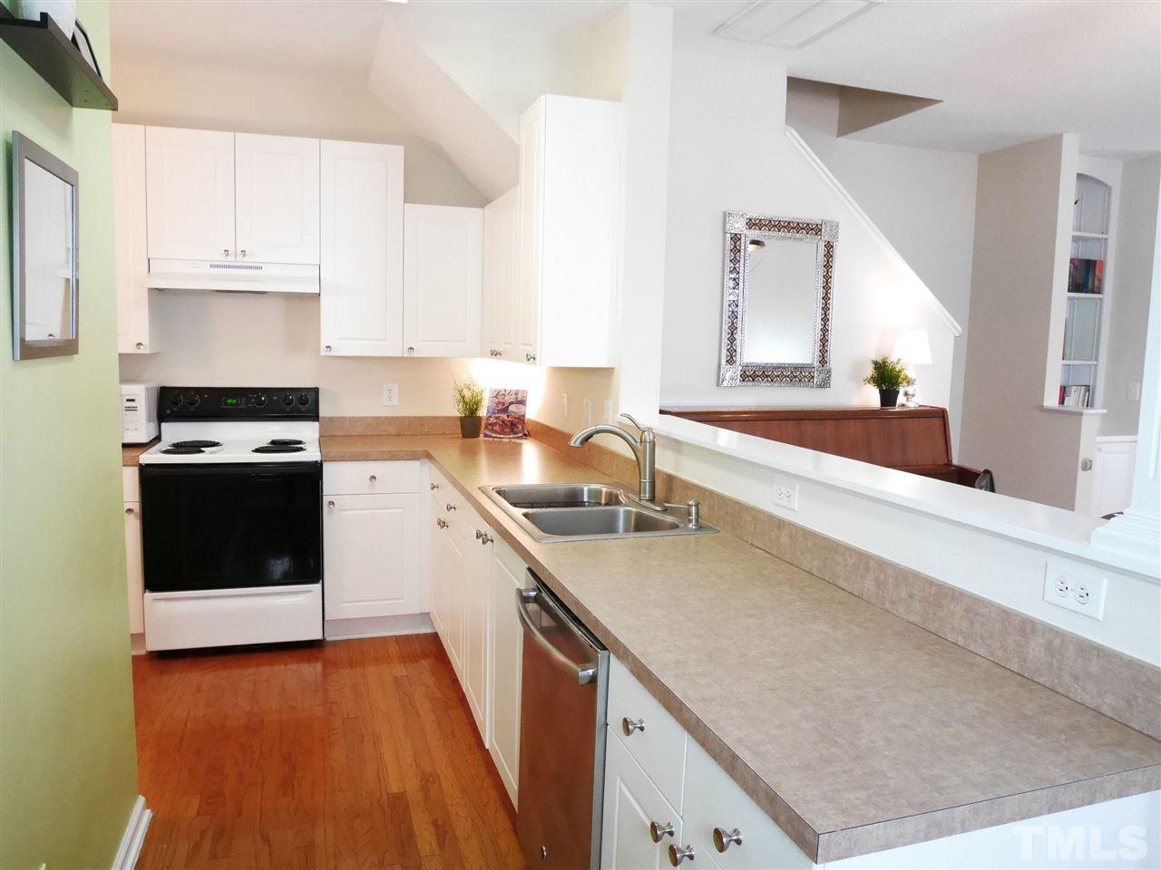 2016 Metacomet Way Raleigh, NC 27604 - Photo 4 of 24 a kitchen with a sink a stove and cabinets