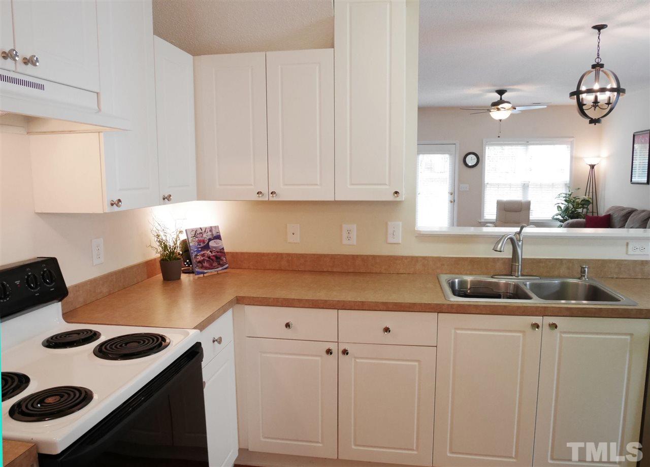 2016 Metacomet Way Raleigh, NC 27604 - Photo 5 of 24 a kitchen with cabinets and window