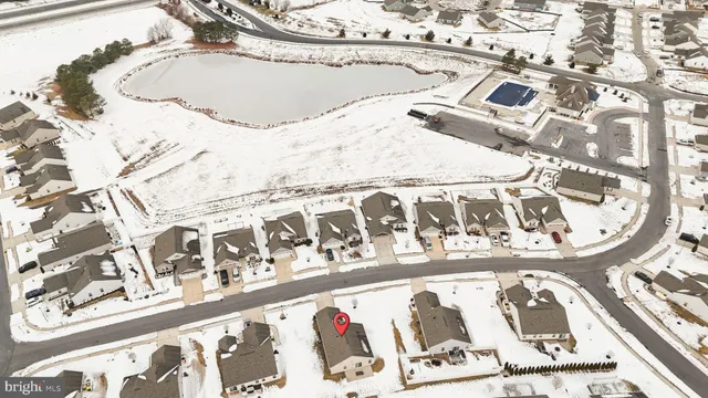 a view of a refrigerator in kitchen and wooden floor