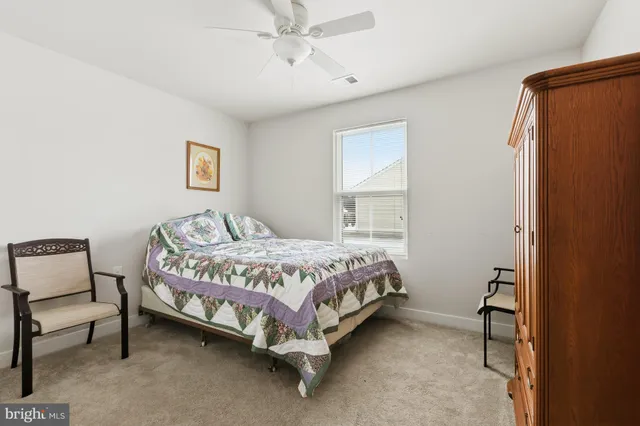 a bathroom with a sink a toilet and shower curtain
