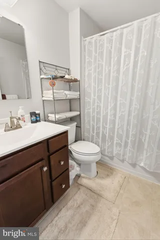 a kitchen with kitchen island granite countertop wooden cabinets and stainless steel appliances