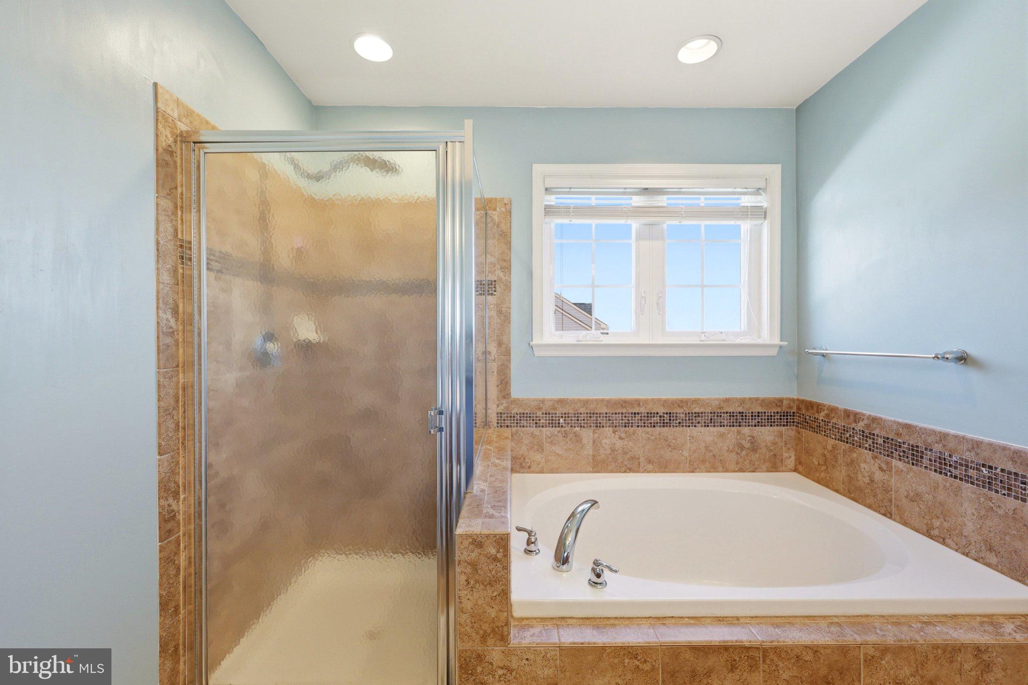 486 Calvert Circle Bunker Hill, WV 25413 - Photo 28 of 52 a bathroom with a bathtub and a shower