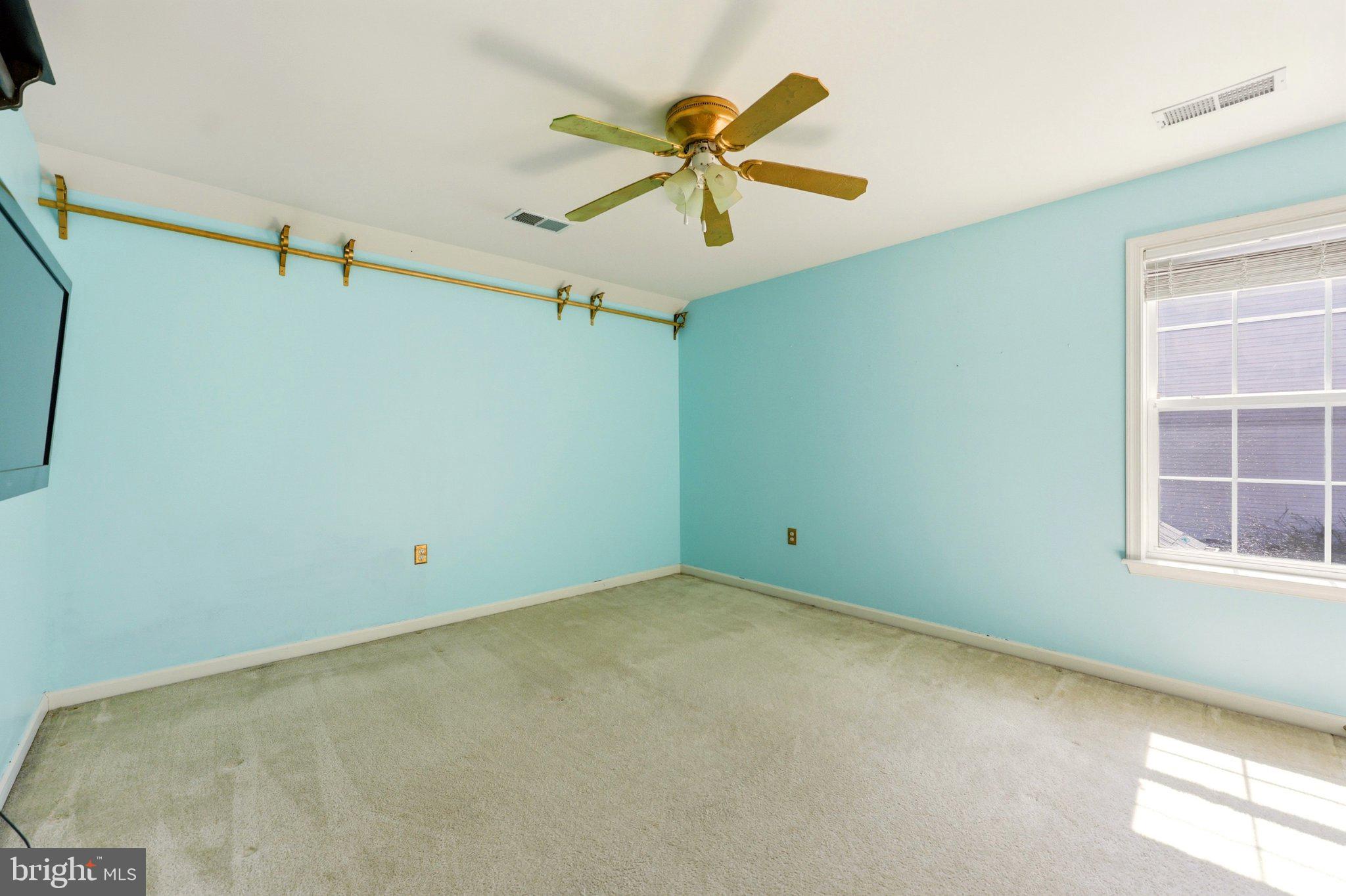 486 Calvert Circle Bunker Hill, WV 25413 - Photo 33 of 52 an empty room with windows and fan