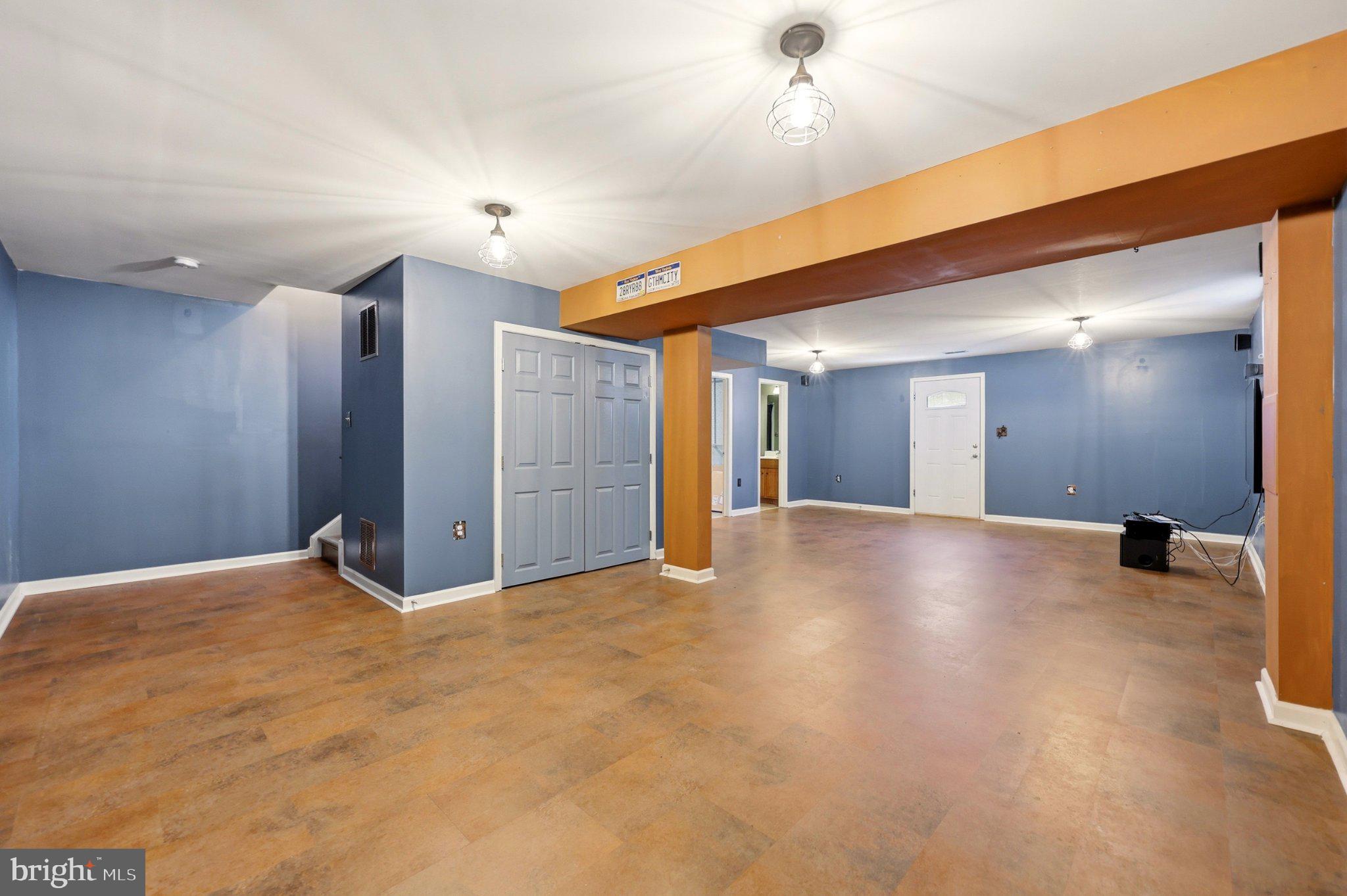 486 Calvert Circle Bunker Hill, WV 25413 - Photo 36 of 52 a view of an empty room with a ceiling fan