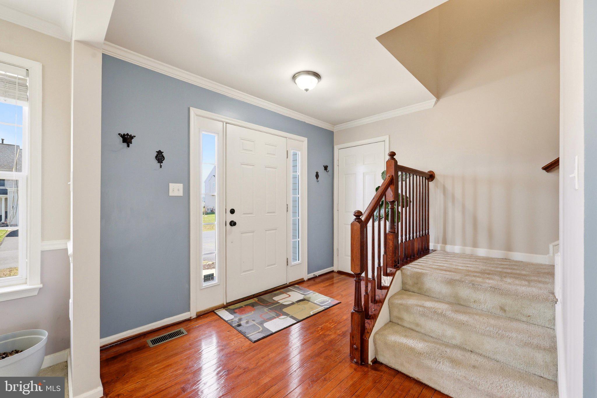 486 Calvert Circle Bunker Hill, WV 25413 - Photo 4 of 52 a view of entryway with wooden floor