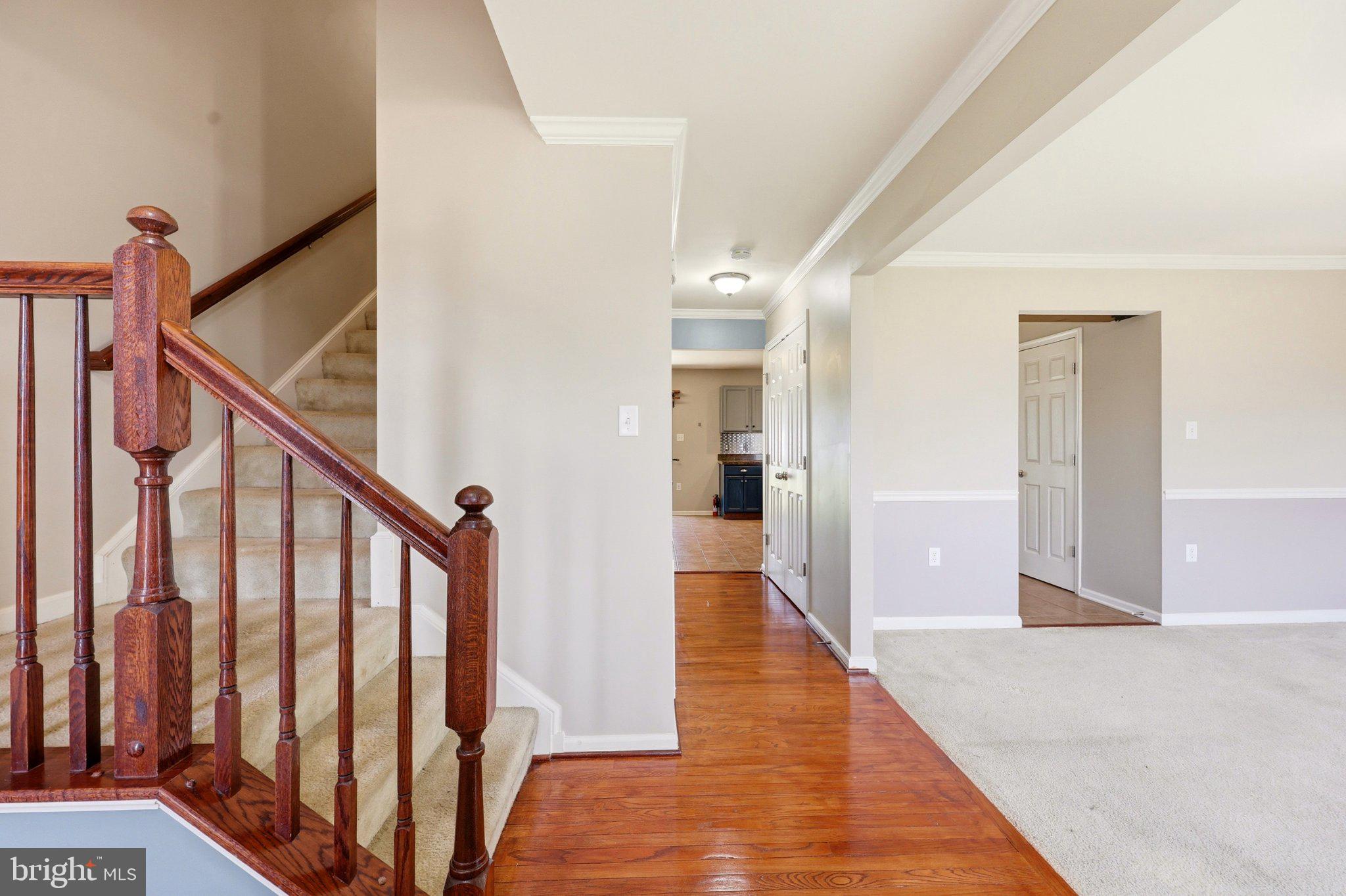 486 Calvert Circle Bunker Hill, WV 25413 - Photo 5 of 52 a view of a hallway with wooden floor and staircase