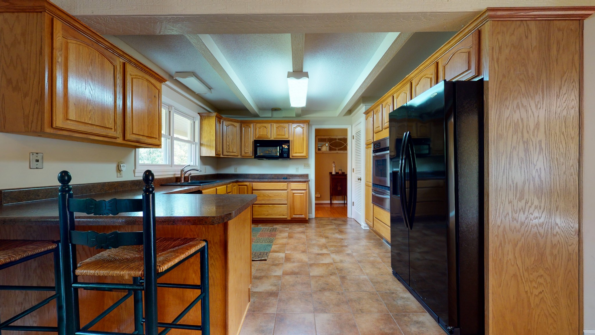 4741 Cathey Ridge Road Manchester, TN 37355 - Photo 24 of 50 a kitchen with stainless steel appliances kitchen island granite countertop a refrigerator and cabinets