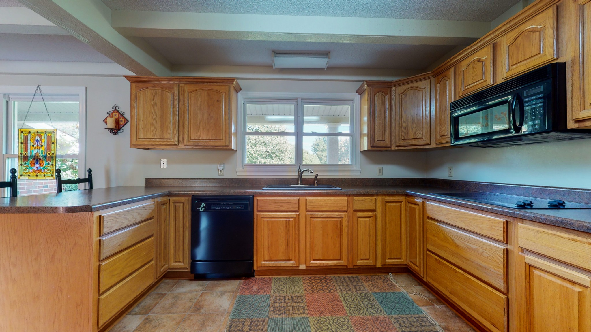 4741 Cathey Ridge Road Manchester, TN 37355 - Photo 26 of 50 a kitchen with stainless steel appliances granite countertop a stove sink and cabinets