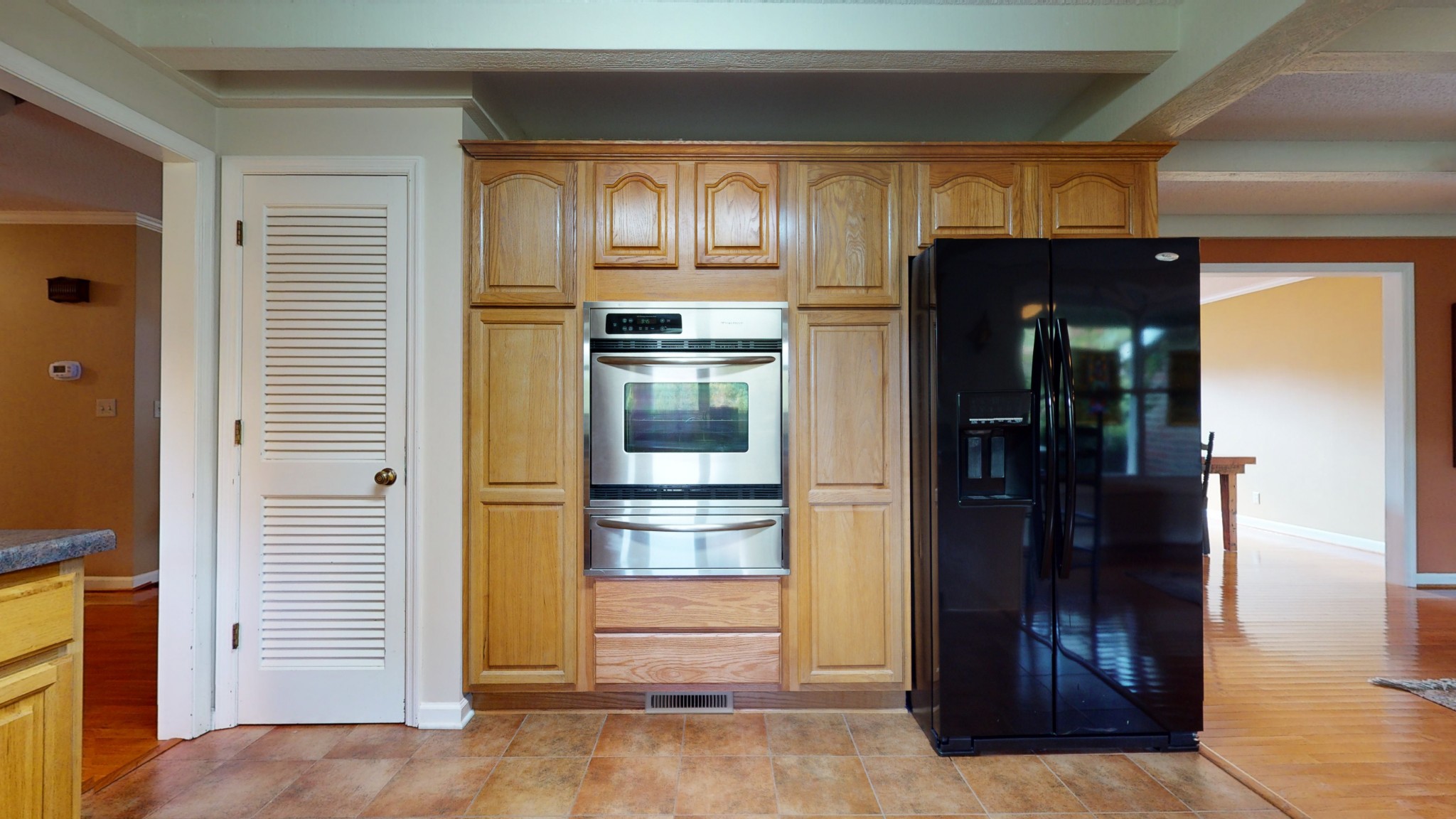 4741 Cathey Ridge Road Manchester, TN 37355 - Photo 27 of 50 a kitchen with a refrigerator and cabinets