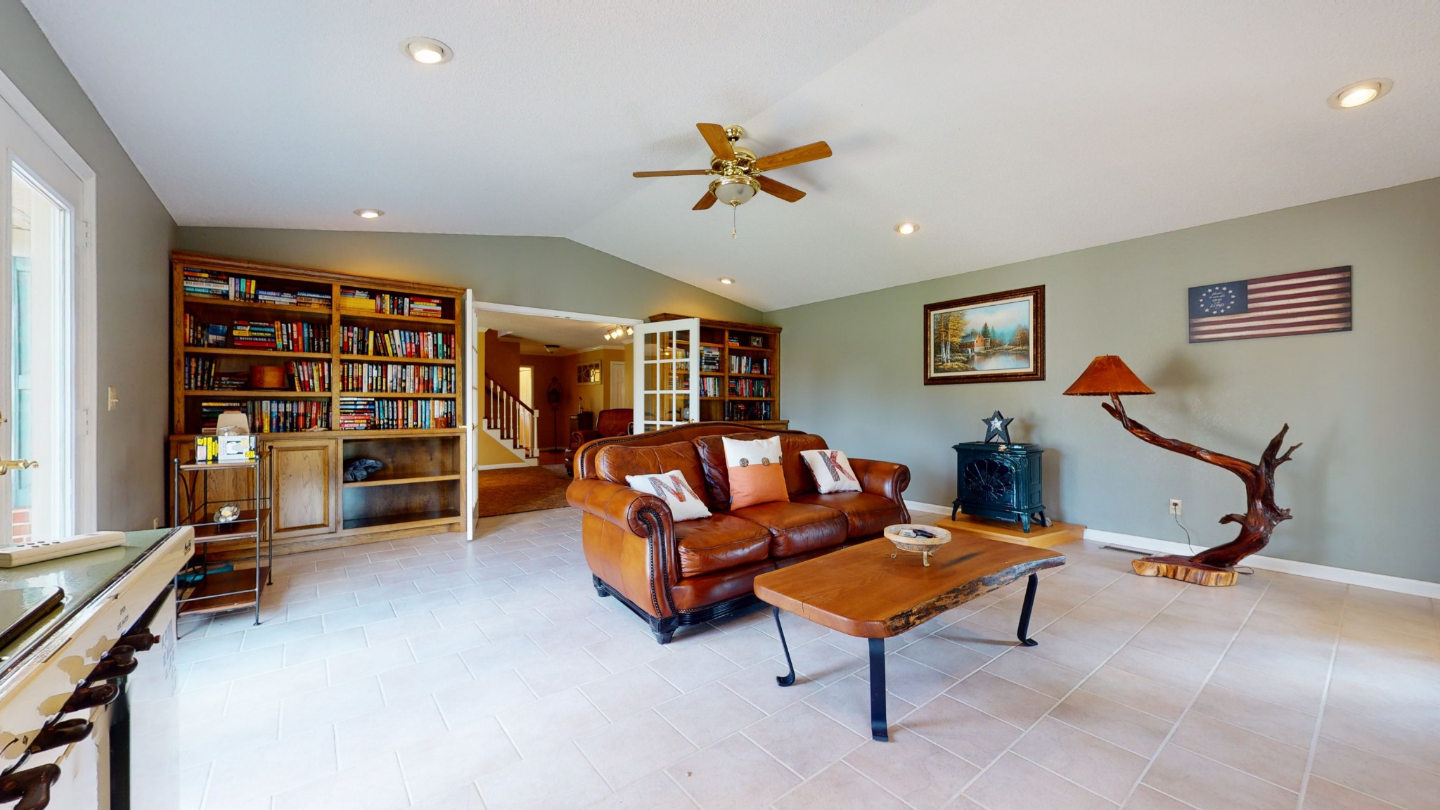 4741 Cathey Ridge Road Manchester, TN 37355 - Photo 37 of 50 a living room with furniture a ceiling fan and a book shelf