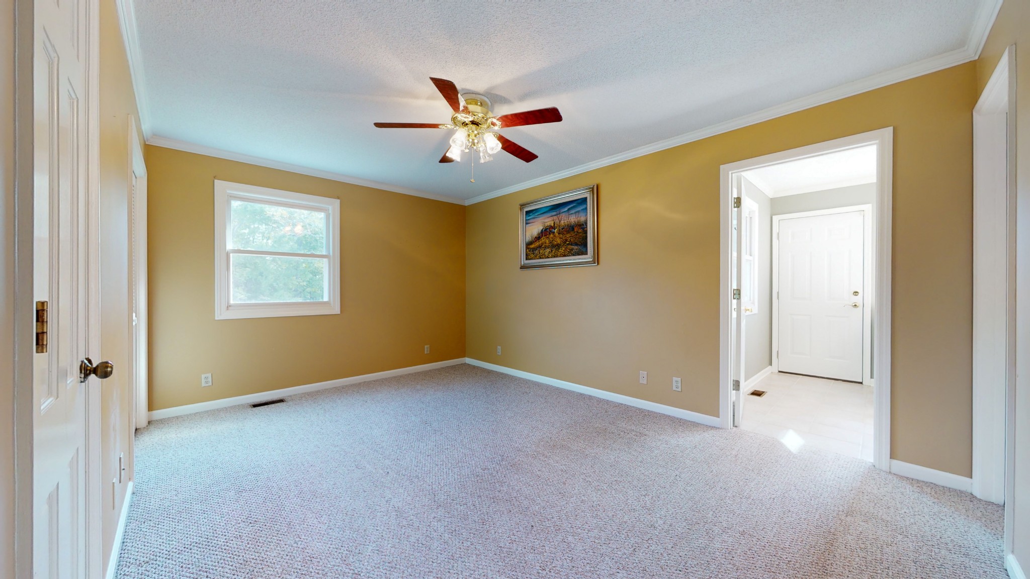 4741 Cathey Ridge Road Manchester, TN 37355 - Photo 41 of 50 a view of an empty room with window and ceiling fan