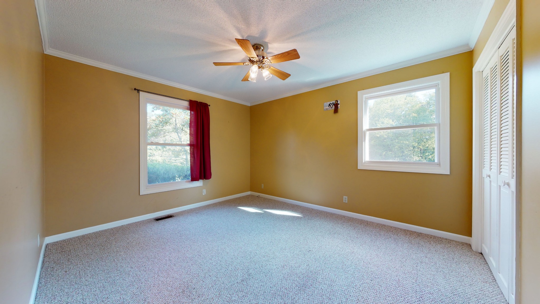 4741 Cathey Ridge Road Manchester, TN 37355 - Photo 44 of 50 an empty room with windows and chandelier fan