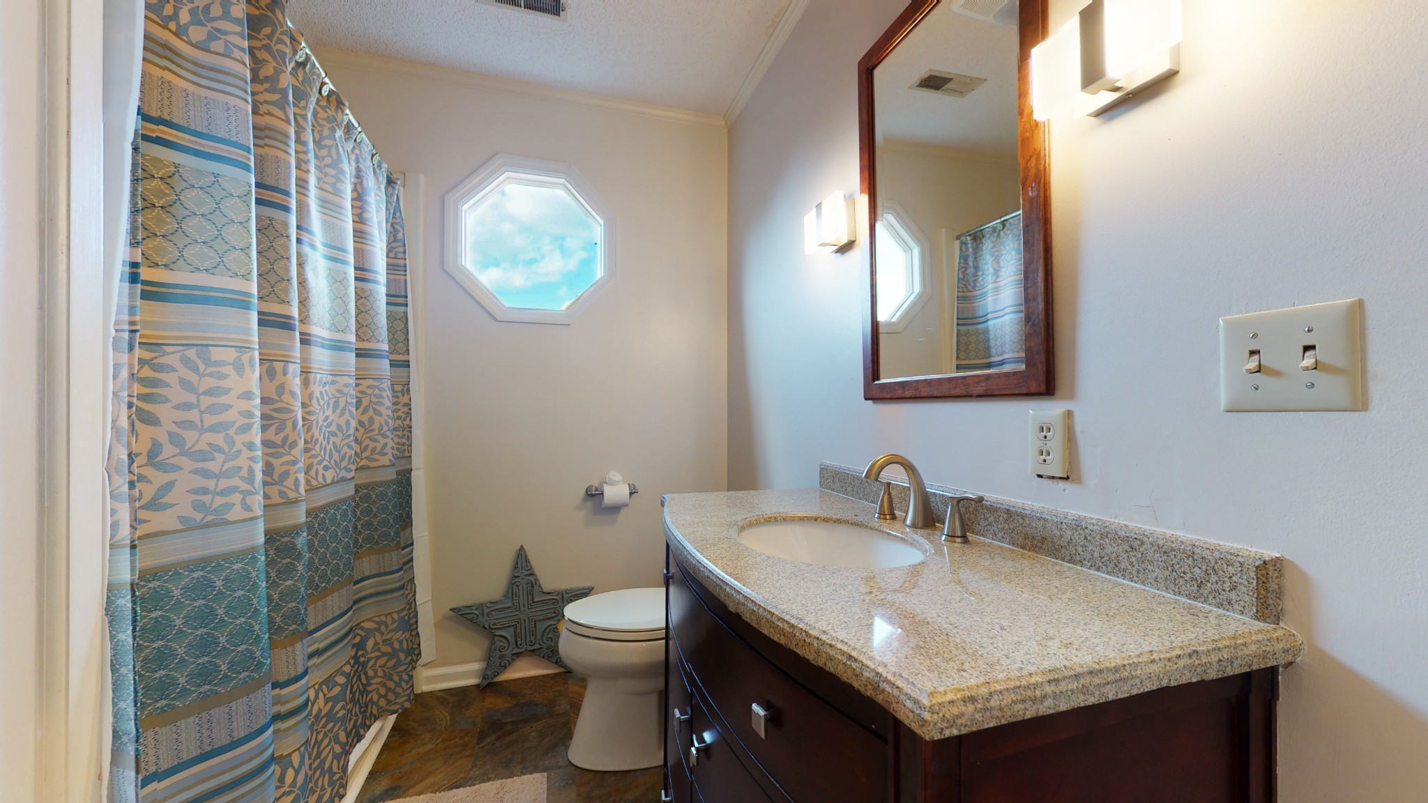 4741 Cathey Ridge Road Manchester, TN 37355 - Photo 48 of 50 a bathroom with a granite countertop sink a toilet and a mirror
