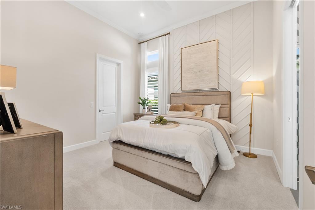 15266 Arpino Court Naples, FL 34114 - Photo 22 of 48 a bedroom with a bed and a lamp