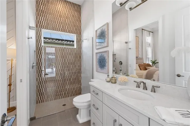 a bedroom with a bed and a lamp