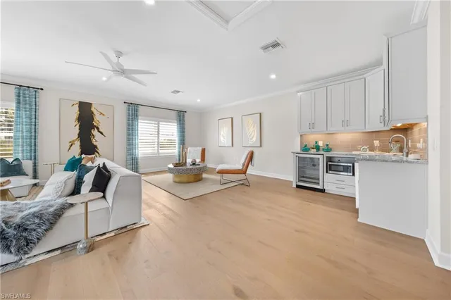 a bathroom with a double vanity sink mirror and toilet
