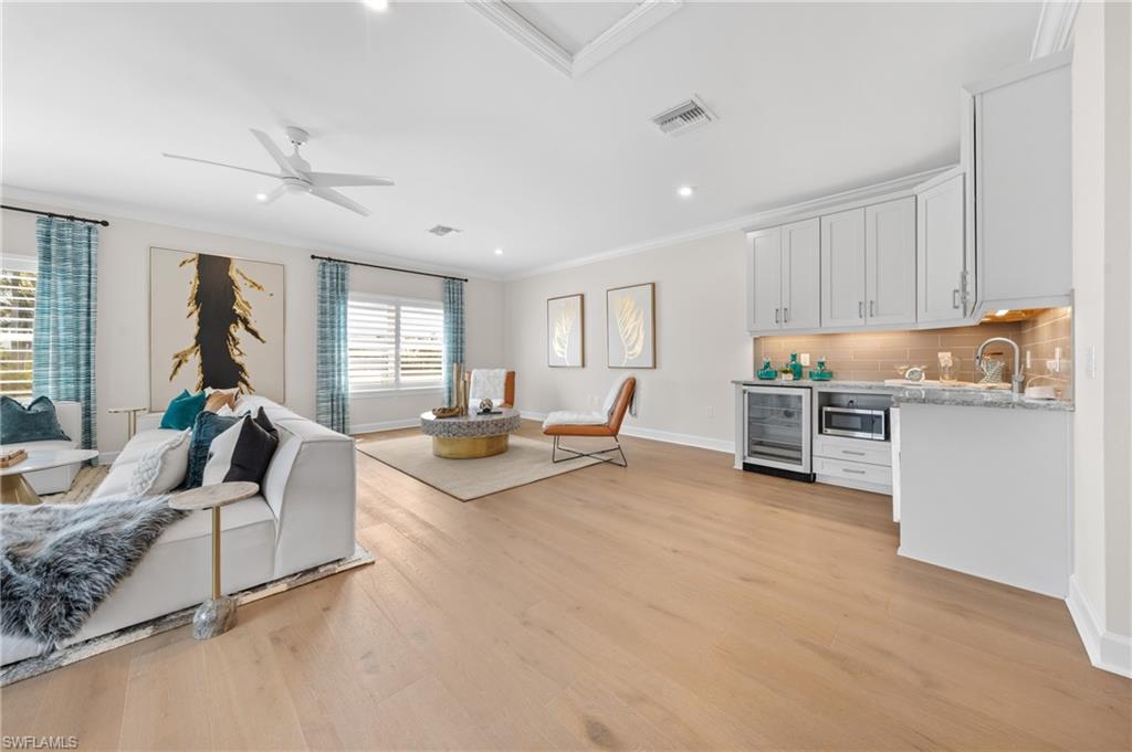 15266 Arpino Court Naples, FL 34114 - Photo 31 of 48 a living room with furniture and a large window