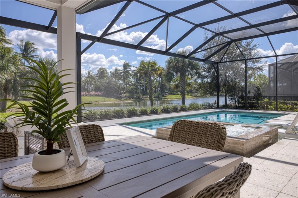 15266 Arpino Court Naples, FL 34114 - Photo 39 of 48 a view of a swimming pool with a patio
