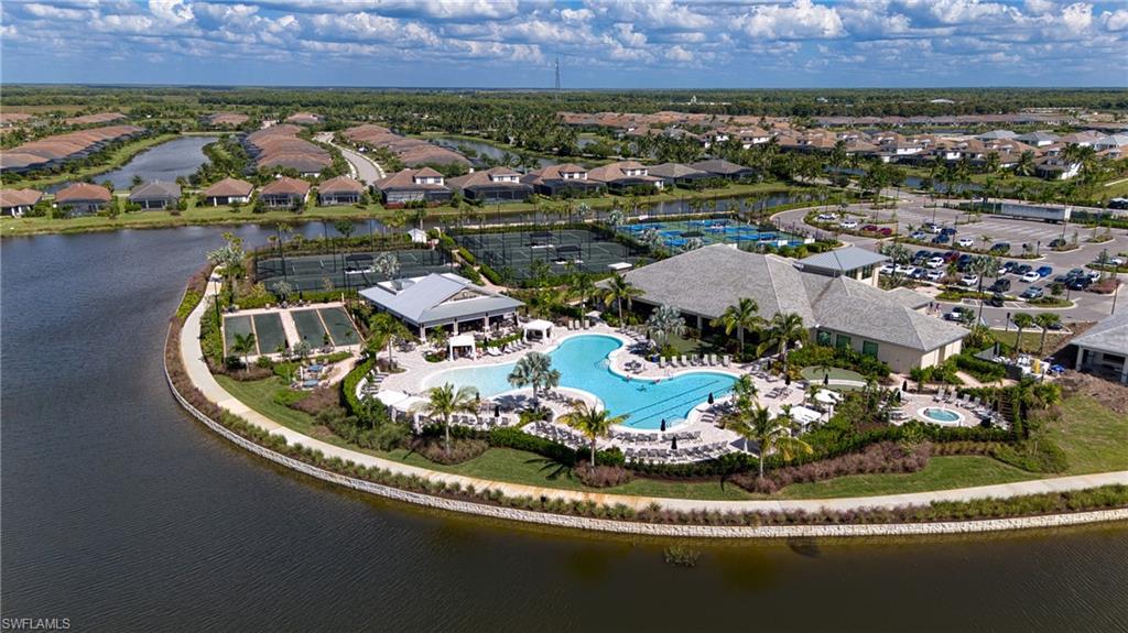 15266 Arpino Court Naples, FL 34114 - Photo 42 of 48 an aerial view of a house with a lake view