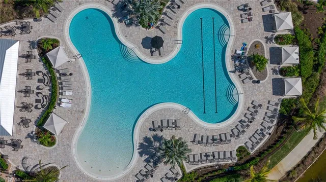 an aerial view of a house with a lake view