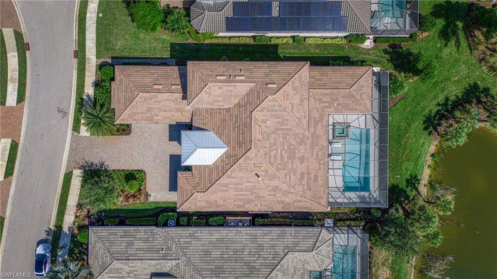 15266 Arpino Court Naples, FL 34114 - Photo 46 of 48 an aerial view of a house with a yard