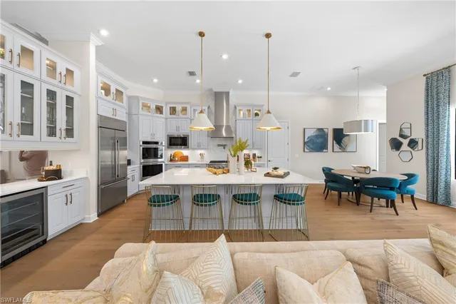 a large kitchen with a table and chairs