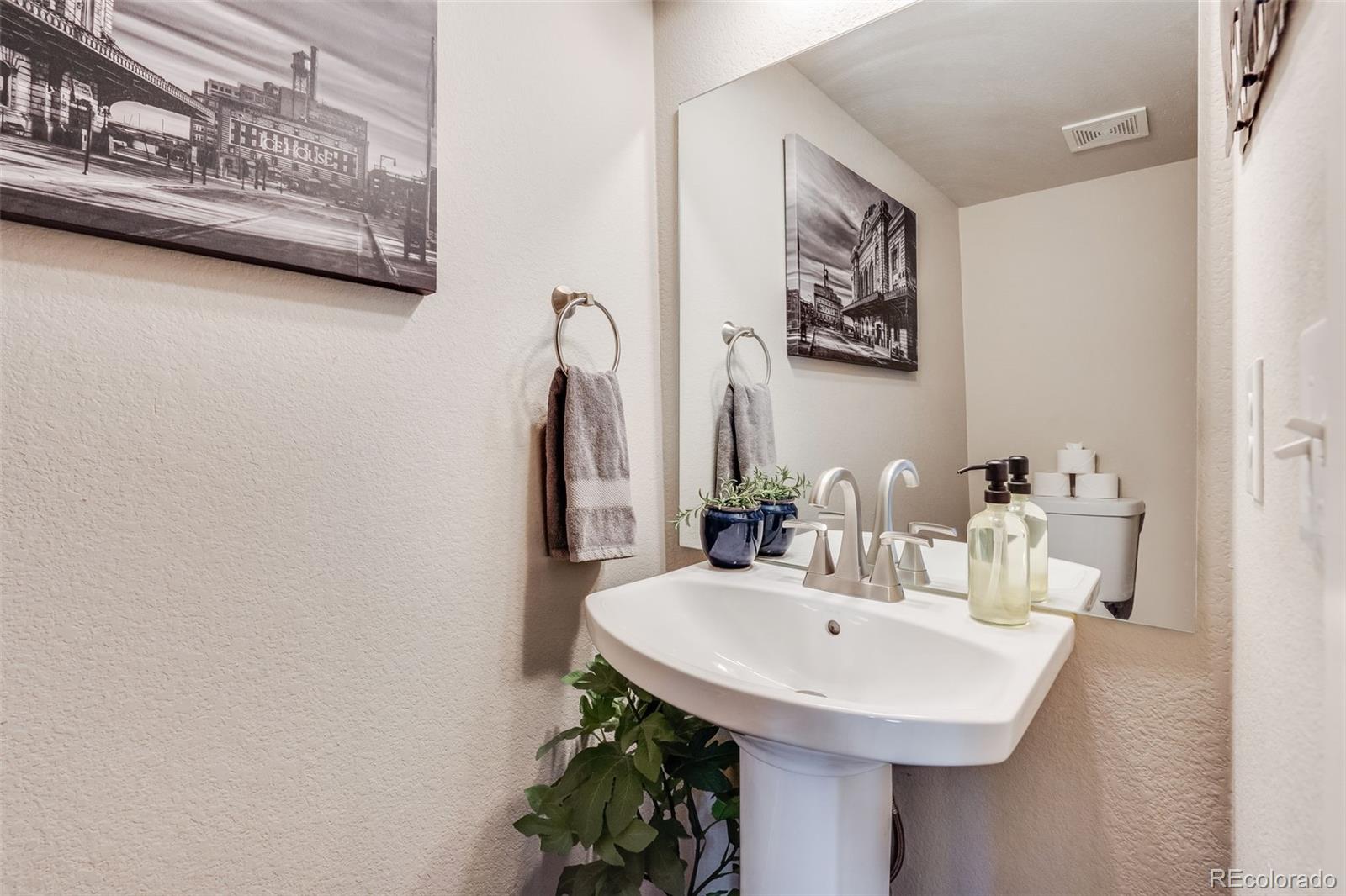 5240 Stuart Street Denver, CO 80212 - Photo 12 of 42 a bathroom with a sink and a mirror