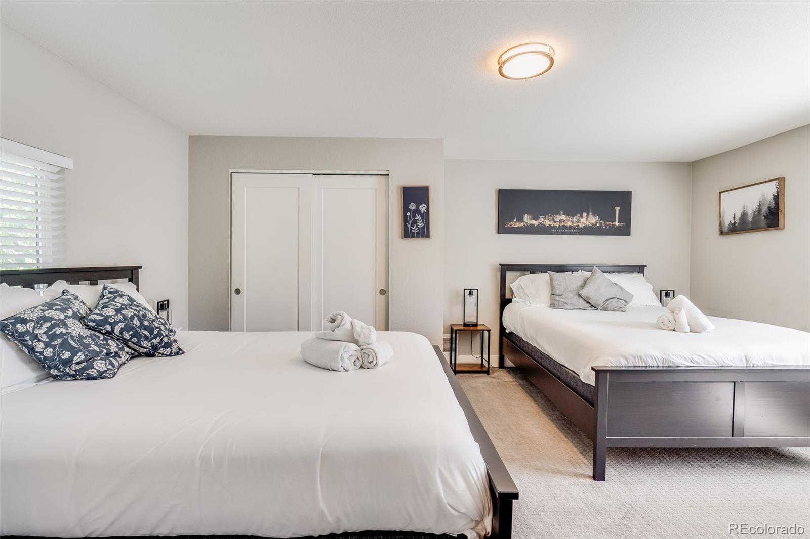 5240 Stuart Street Denver, CO 80212 - Photo 17 of 42 a bedroom with a bed and a couch