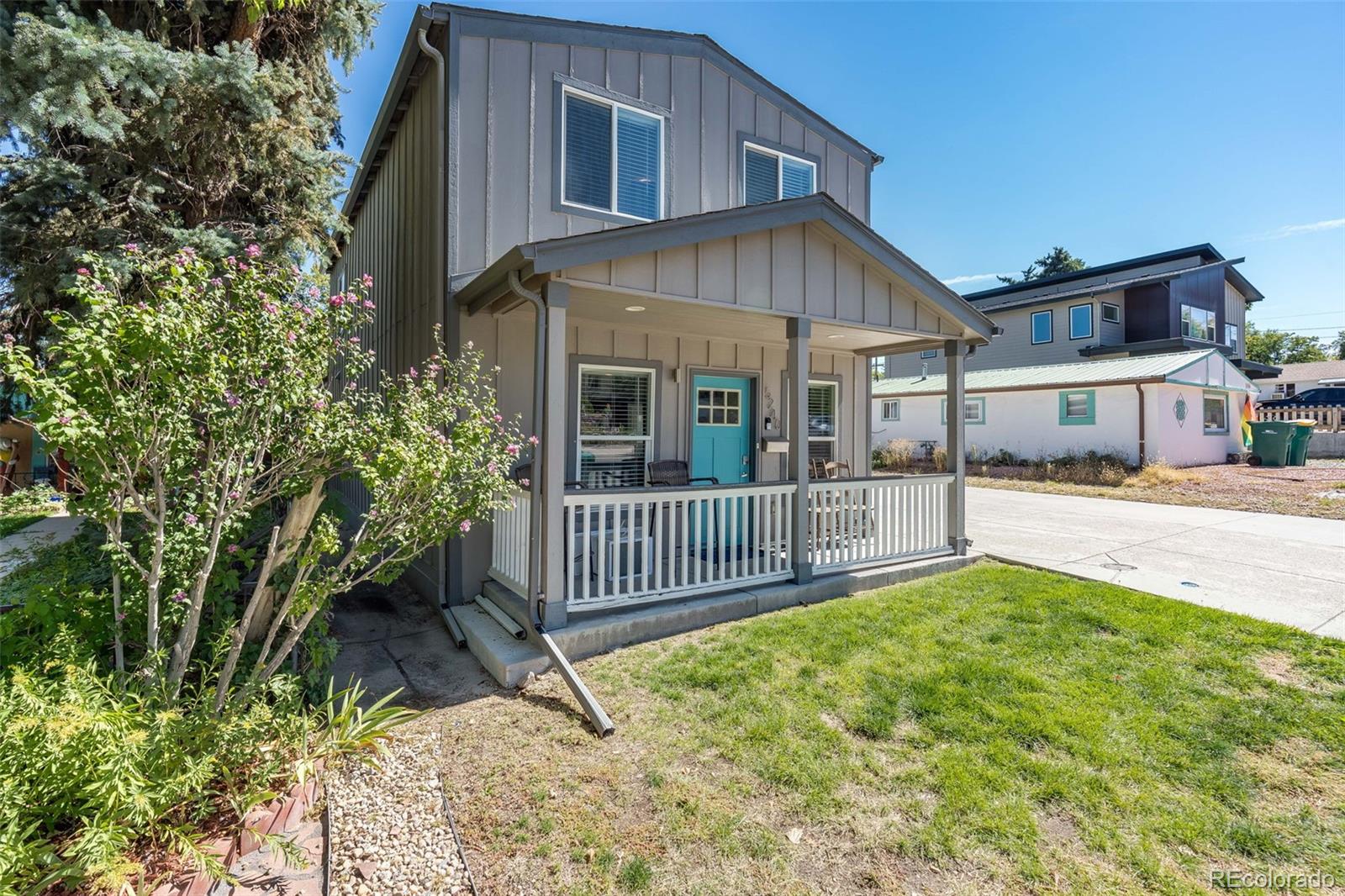 5240 Stuart Street Denver, CO 80212 - Photo 2 of 42 a front view of a house with a yard