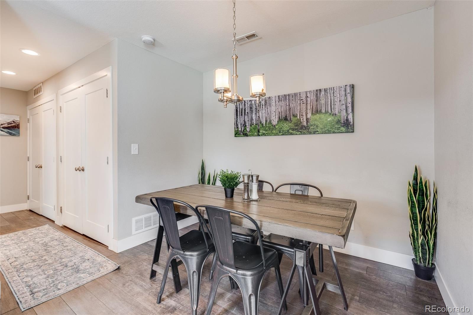 5240 Stuart Street Denver, CO 80212 - Photo 27 of 42 a view of a dining room with furniture and wooden floor