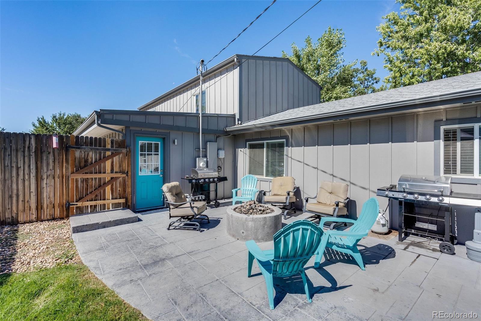 5240 Stuart Street Denver, CO 80212 - Photo 31 of 42 a view of a patio with couches and potted plants