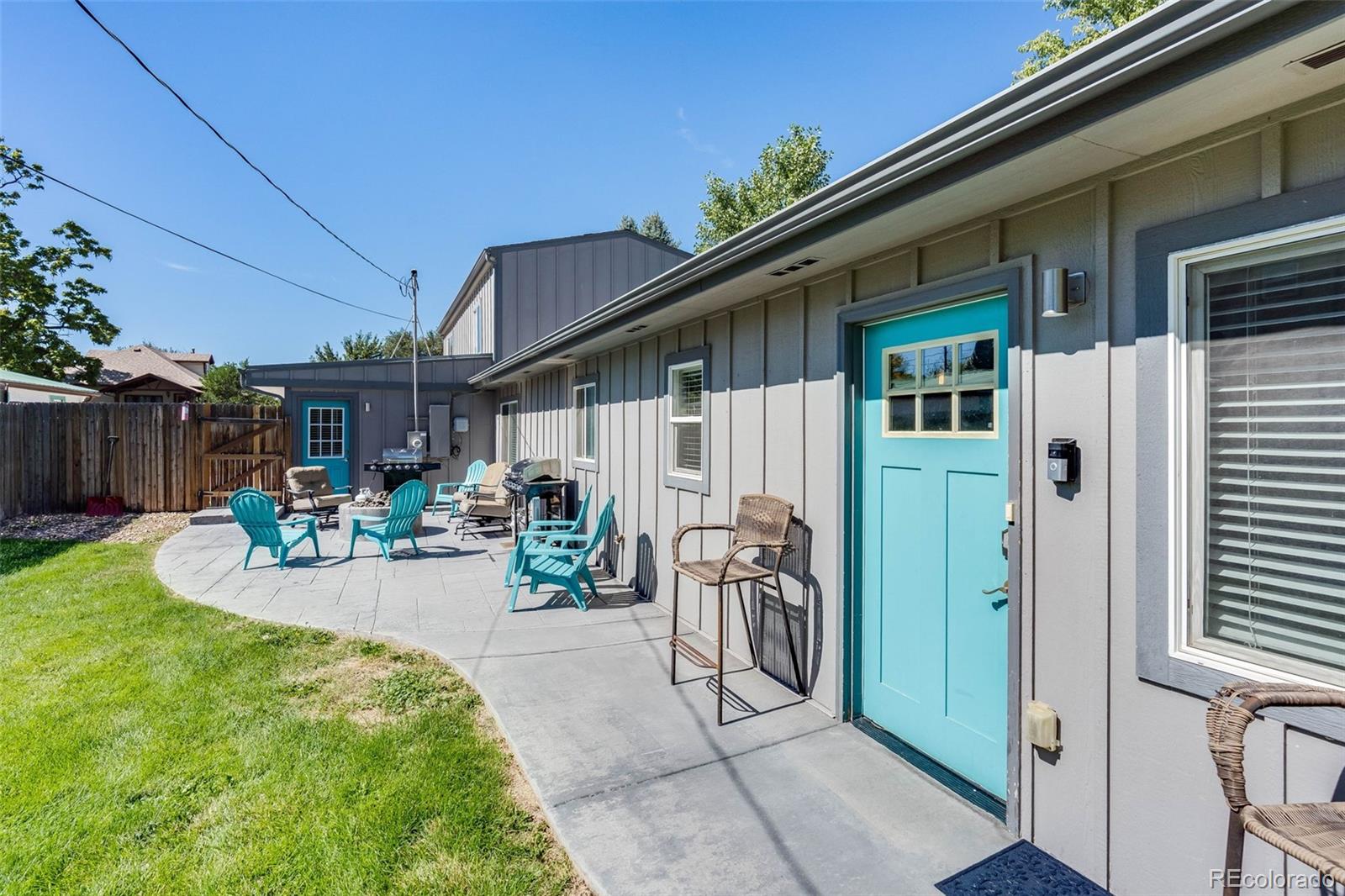 5240 Stuart Street Denver, CO 80212 - Photo 33 of 42 a view of a backyard with potted plants and a large tree