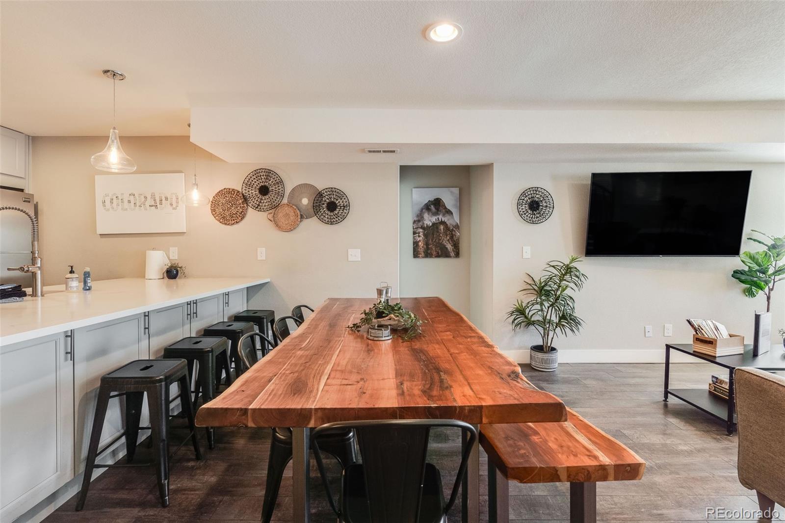 5240 Stuart Street Denver, CO 80212 - Photo 7 of 42 a living room with furniture and a flat screen tv