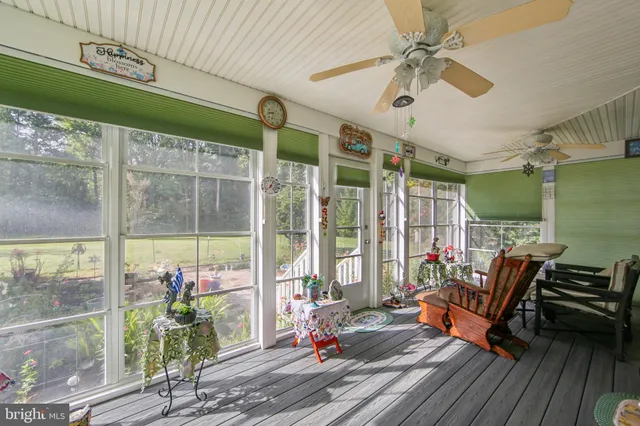 a bedroom with furniture and a flat screen tv